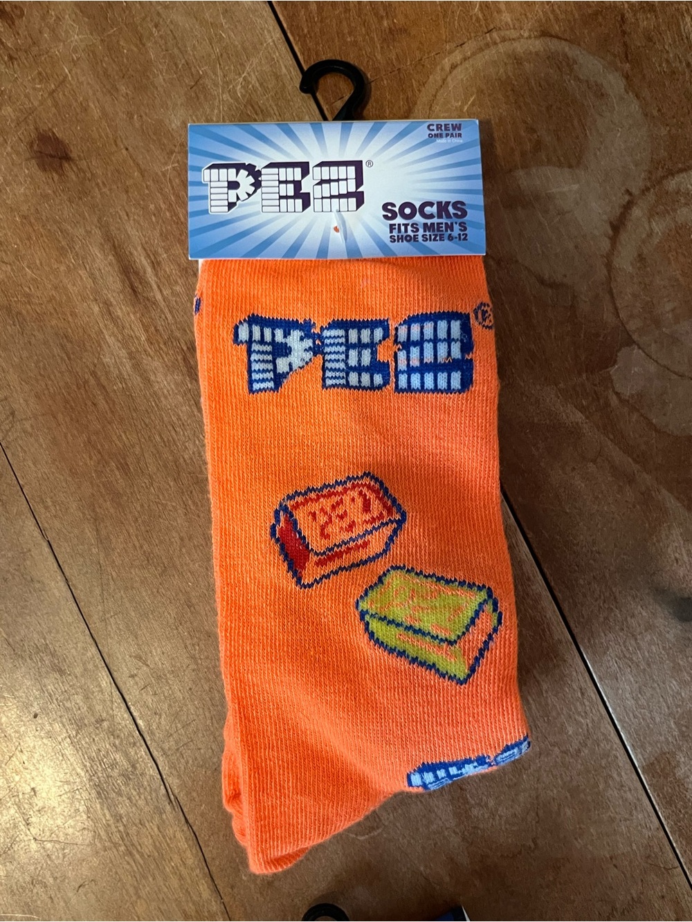 Men’s Crew Socks in Vibrant Orange with Candy Motif